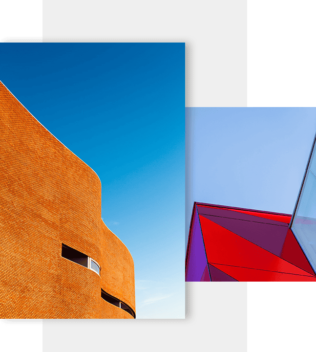 Innovative modern architecture with colourful glass and brick facades in a cityscape.