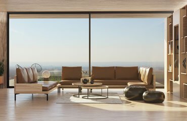 A living room with large windows and wooden furniture.