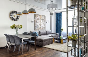 A living room and dining room in a modern apartment.